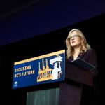 B.C. Finance Minister presents the 2026 provincial budget in Victoria at a podium displaying the slogan “Securing BC’s Future | Budget 2026.”