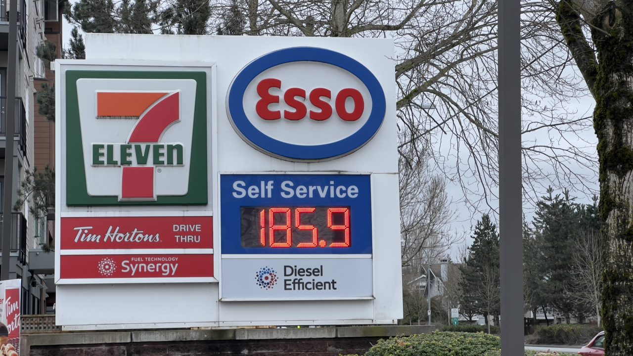 Esso gas station sign showing gasoline price at 185.9 cents per litre at a 7-Eleven location in Langley, British Columbia.