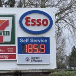 Esso gas station sign showing gasoline price at 185.9 cents per litre at a 7-Eleven location in Langley, British Columbia.
