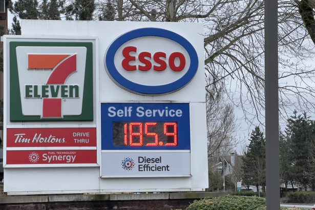 Esso gas station sign showing gasoline price at 185.9 cents per litre at a 7-Eleven location in Langley, British Columbia.